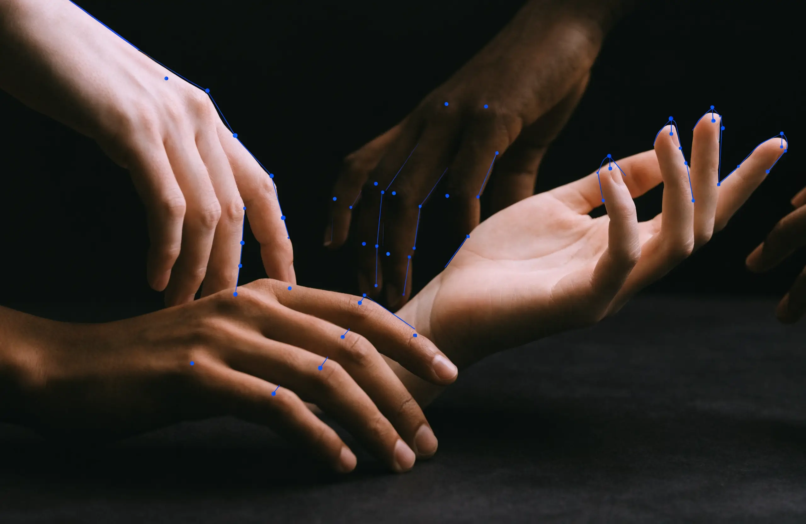 Diverse hands marked with electric-blue measurement landmark points