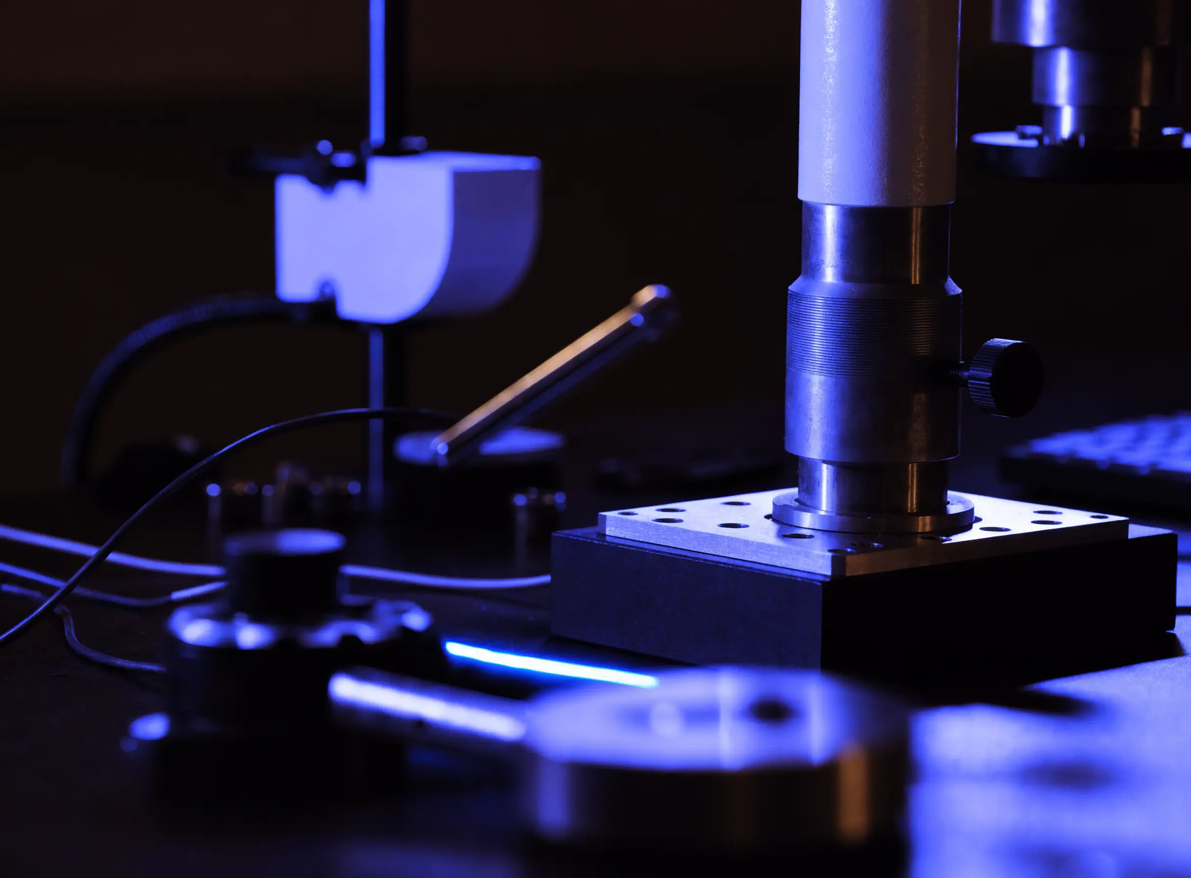 A research workbench with measurement equipment, representing HandMeasured's hands-on build