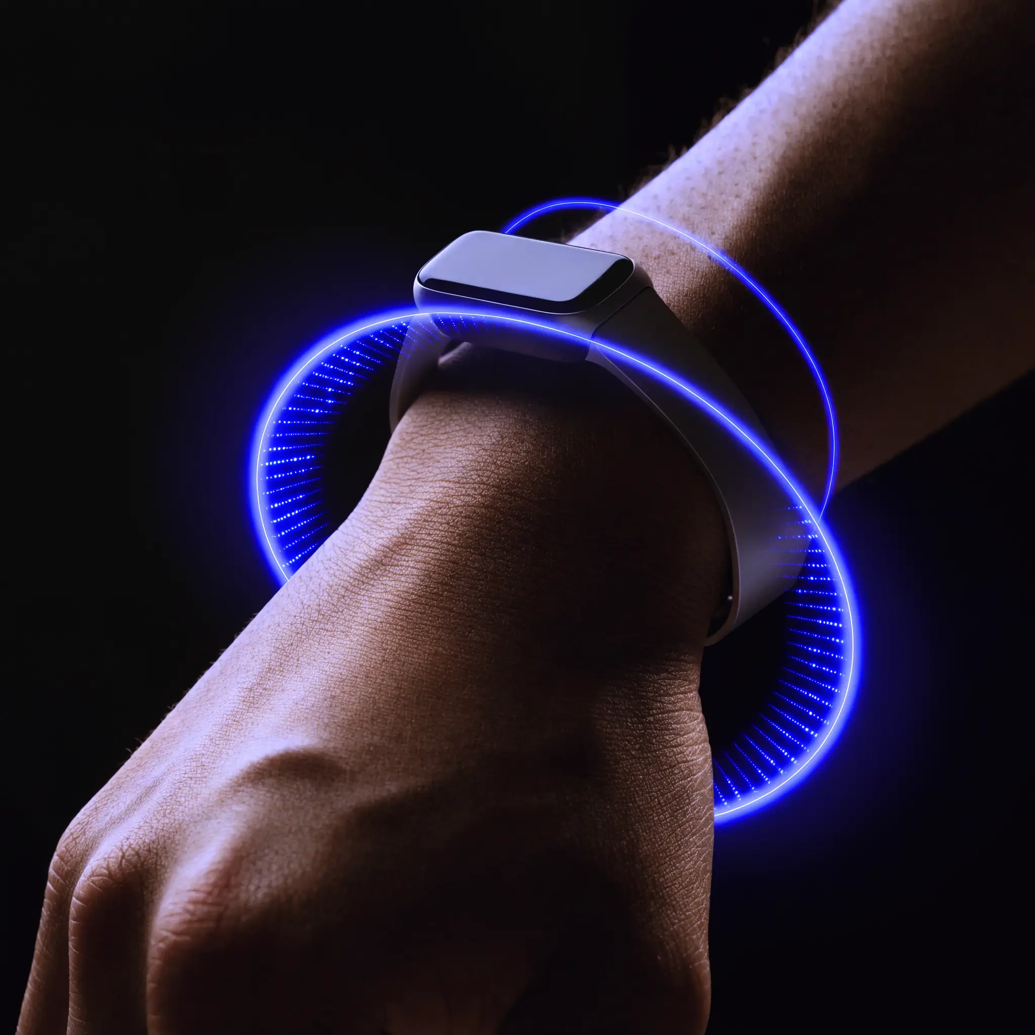 A wrist with a smartwatch and a blue measurement ring